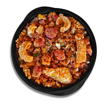 One pot meal of mixed grains, meats, and crispy toppings
